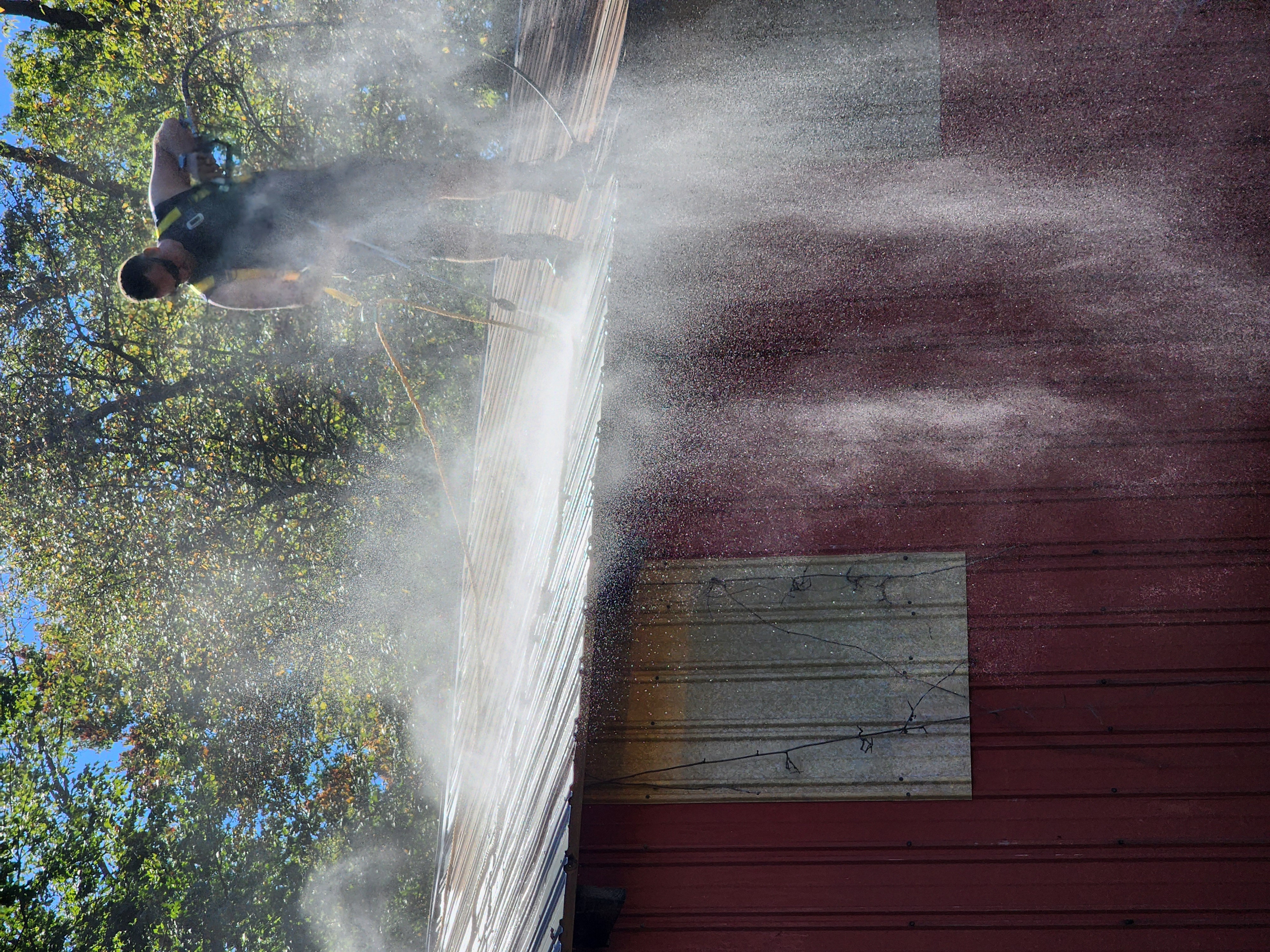 Scott pressure washing barn roof